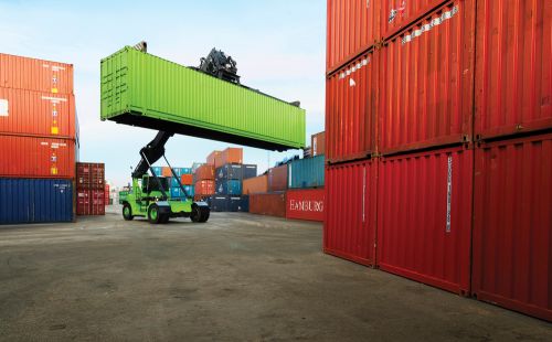 Bring truck lifts green container.