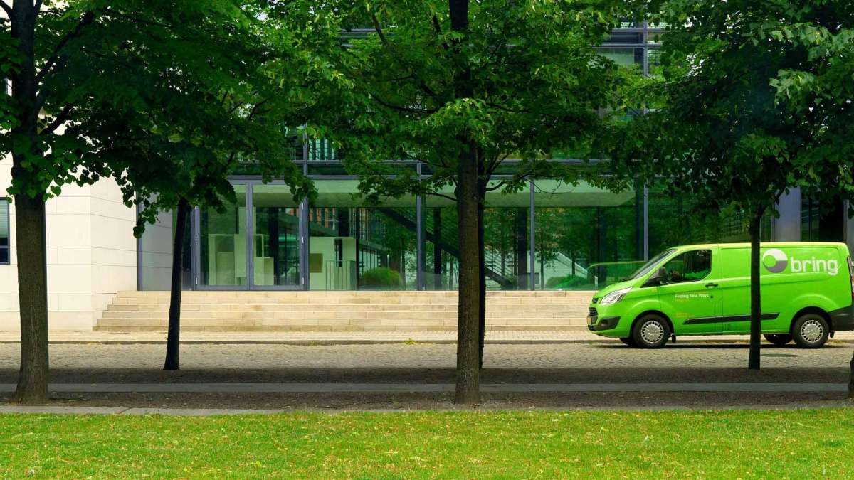 Bring van in front of an office building